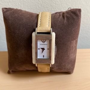 Super cute Emporio Armani tan leather watch. Still has the plastic!